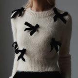 Pullover romantico con fiocchi